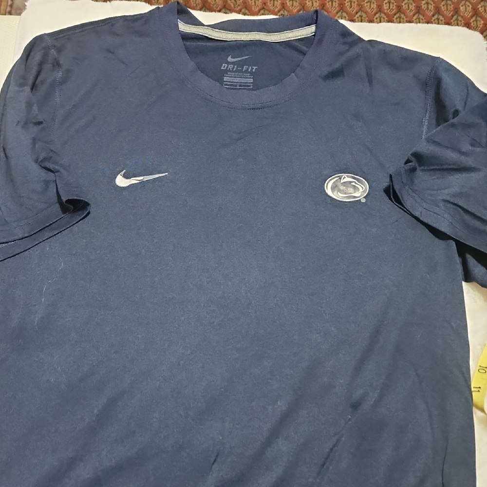 Nike Men's Navy Dri-FIT Tee.  Penn State Logo & Nike Logo On Chest Of Shirt.